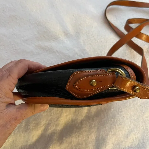 Dooney & Bourke All Weather Leather Black & Tan Saddle Crossbody Bag. - Picture 6 of 9
